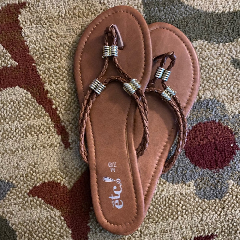 Size 7.8 brown flip flops